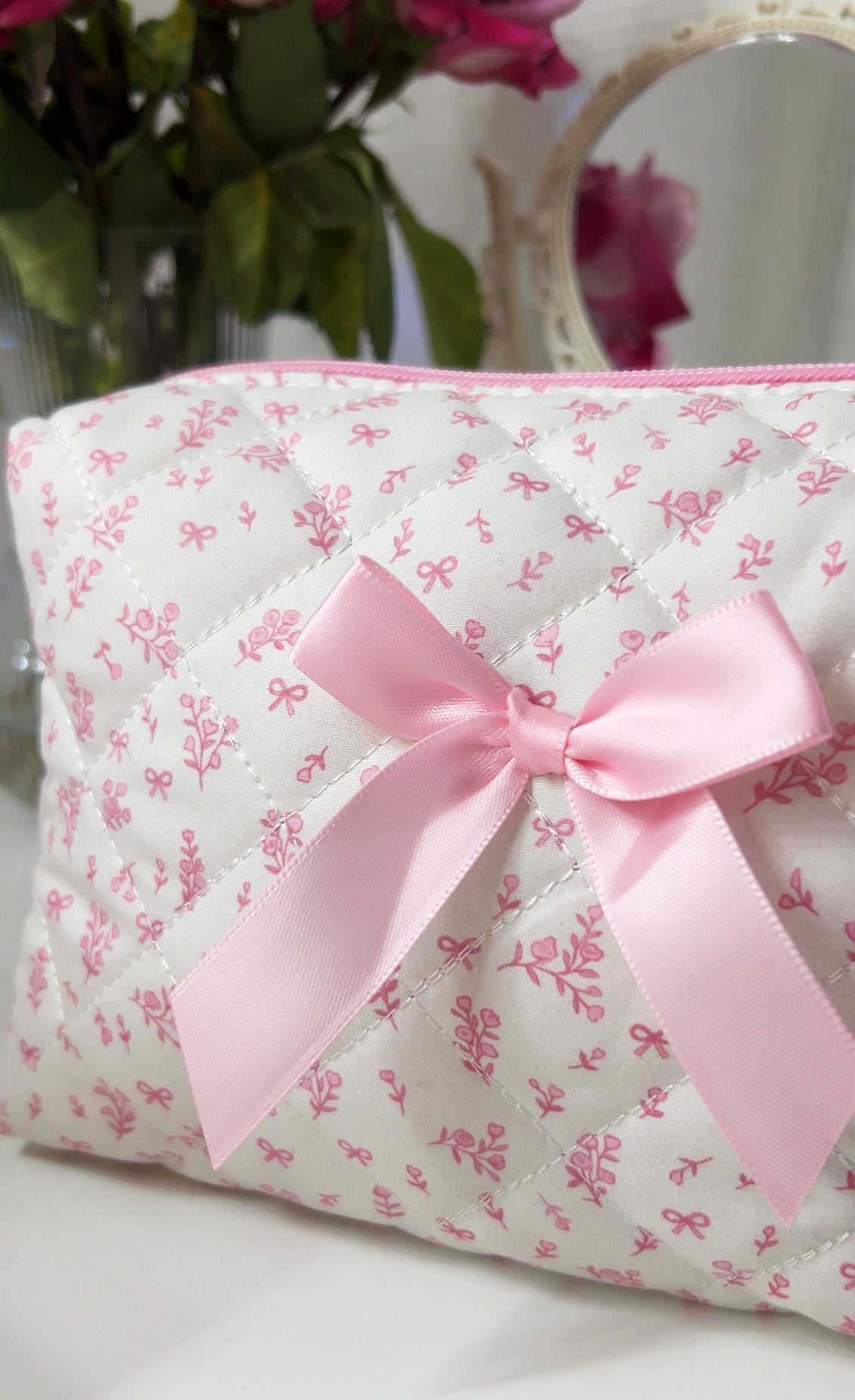 PrettyLittlePink bow makeup bag pink cosmetic pouch with a pink bow close up