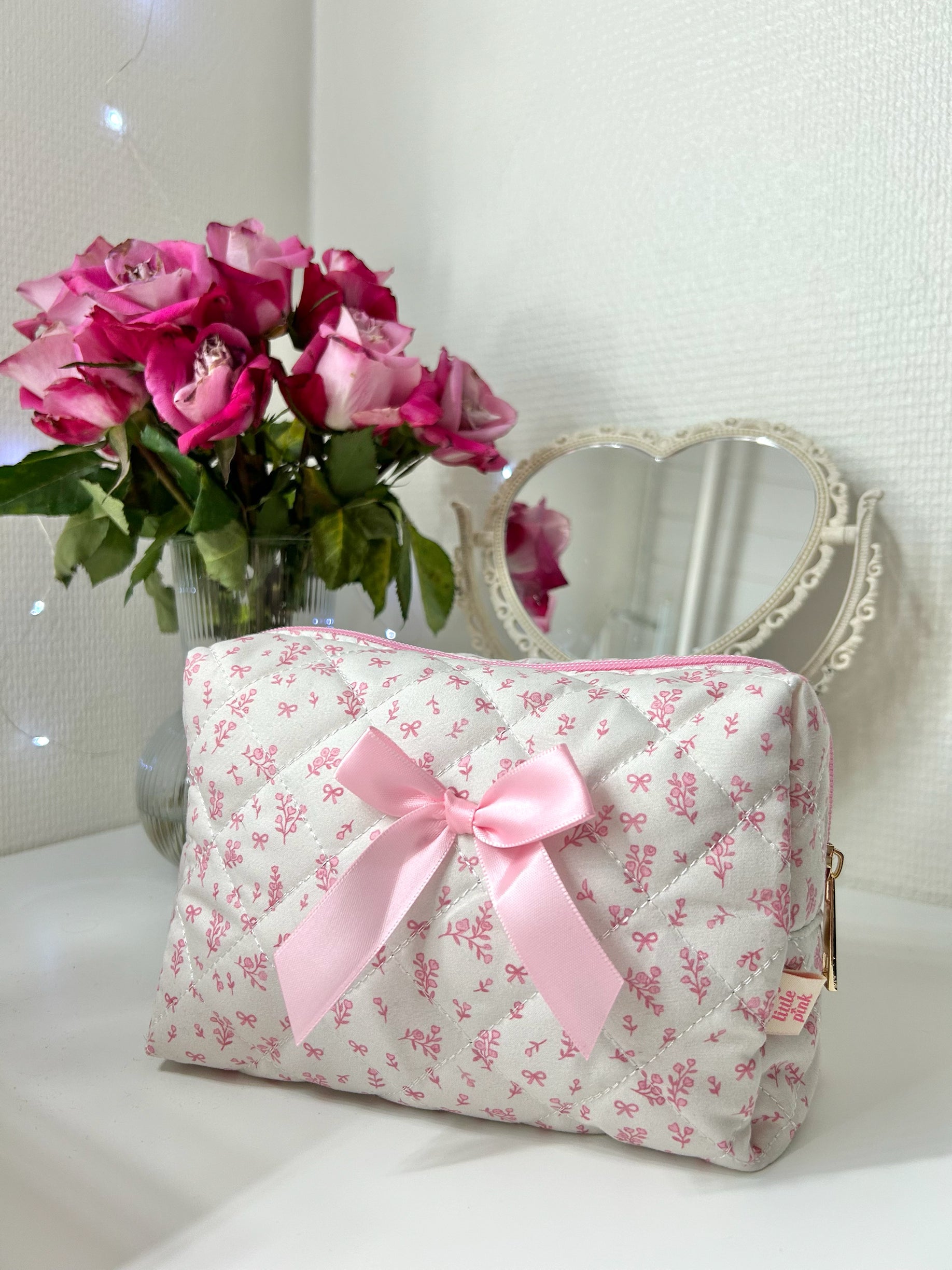 PrettyLittlePink floral bow makeup bag by Josy Marie